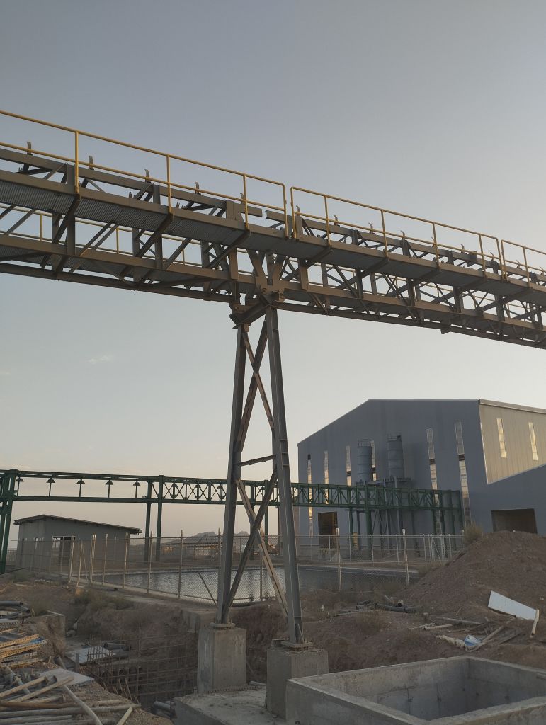 Steel pipe bridge and support framing at an industrial construction site